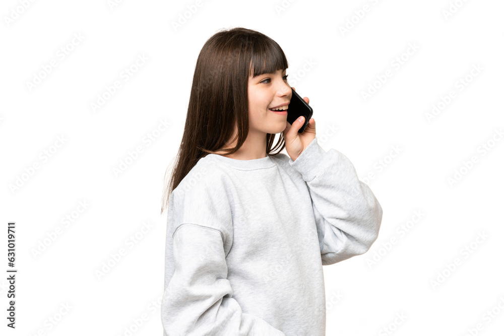 Little girl over isolated green chroma key background keeping a conversation with the mobile phone Little girl over isolated green chroma key background keeping a conversation with the mobile phone