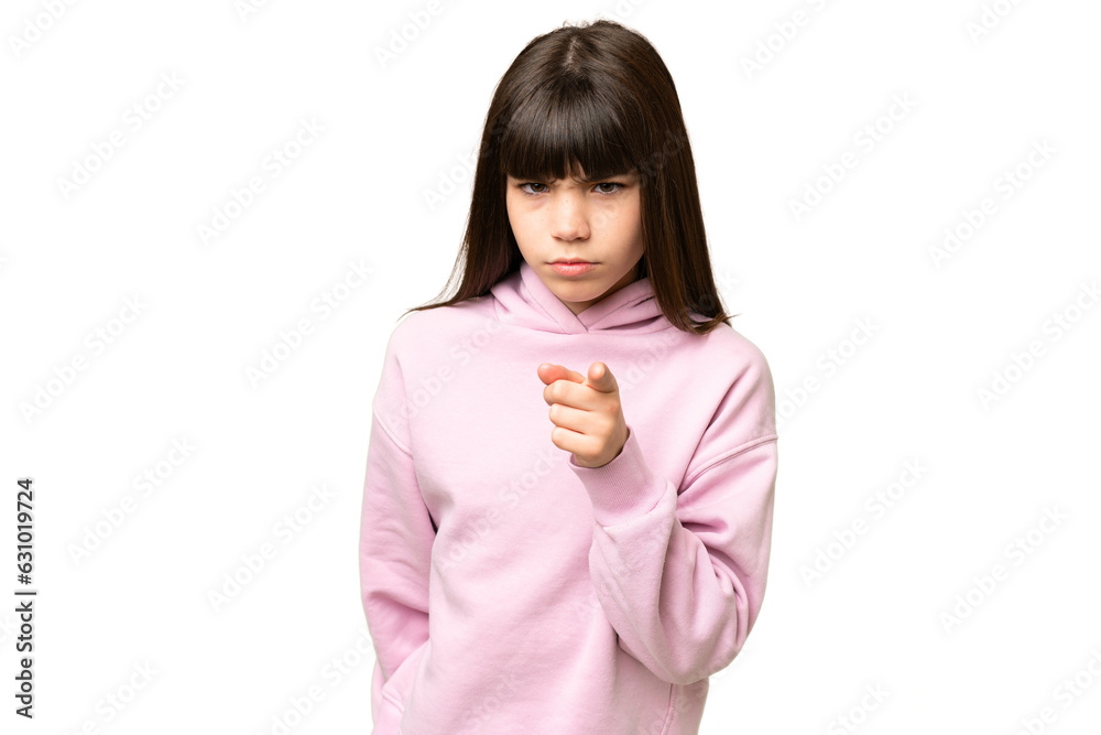 Little girl over isolated green chroma key background frustrated and pointing to the front Little girl over isolated green chroma key background frustrated and pointing to the front