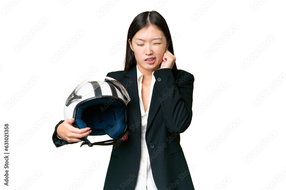 Young Asian woman with a motorcycle helmet over isolated chroma key background frustrated and covering ears Young Asian woman with a motorcycle helmet over isolated chroma key background frustrated and covering ears