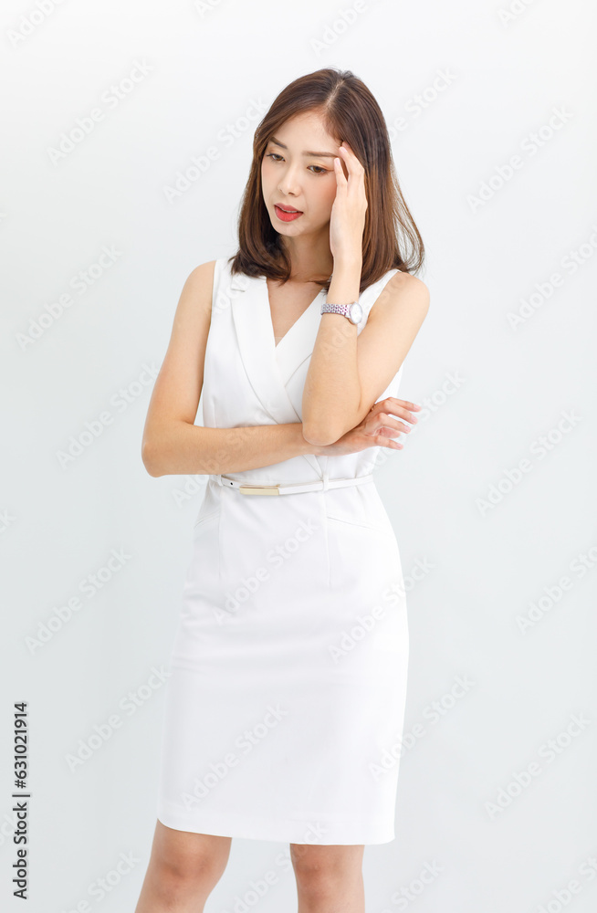 Portrait isolated cutout studio shot of Asian beautiful professional successful female businesswoman ceo entrepreneur in casual business wear standing smiling posing crossed arms on white background Portrait isolated cutout studio shot of Asian beautiful professional successful female businesswoman ceo entrepreneur in casual business wear standing smiling posing crossed arms on white background