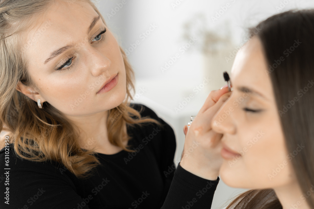 The photo fragment captures the moment when the beautician improves the contour of the eyebrows, giving them clarity and harmony. This process is an important step in creating an expressive face and The photo fragment captures the moment when the beautician improves the contour of the eyebrows, giving them clarity and harmony. This process is an important step in creating an expressive face and