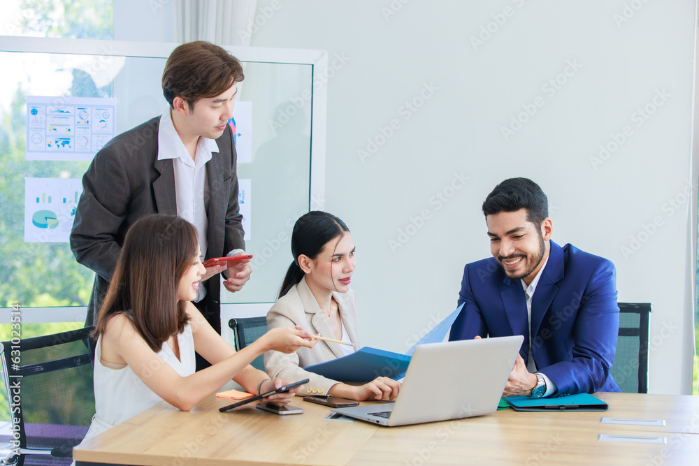 Fototapeta premium Millennial Asian Indian multinational professional successful businessmen and businesswomen in formal suit helping brainstorming working as teamwork via laptop notebook computer in company office