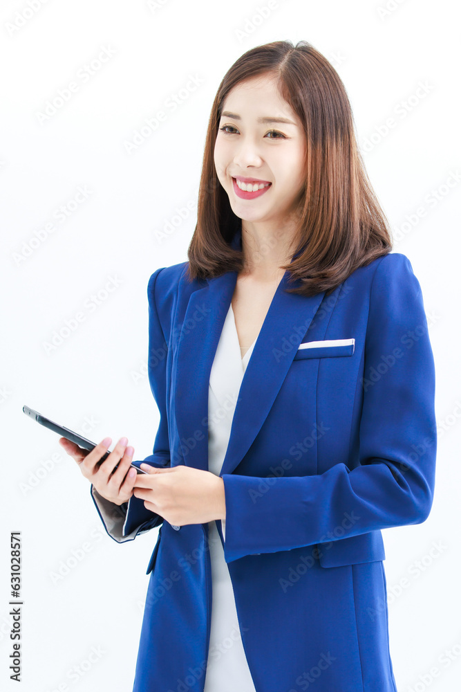 Isolated cutout studio shot Asian beautiful professional successful female businesswoman employee in formal business suit wear standing smiling using touchscreen tablet computer on white background Isolated cutout studio shot Asian beautiful professional successful female businesswoman employee in formal business suit wear standing smiling using touchscreen tablet computer on white background
