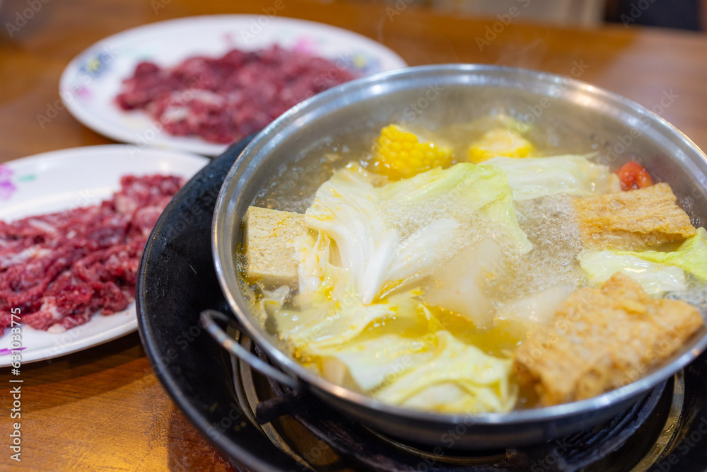 Fresh raw slice of beef in Hot Pot restaurant Fresh raw slice of beef in Hot Pot restaurant