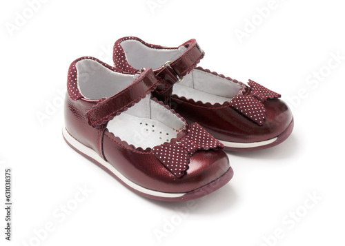 Elegant children's patent leather shoes for toddlers on a white background. Leather shoes for girls.