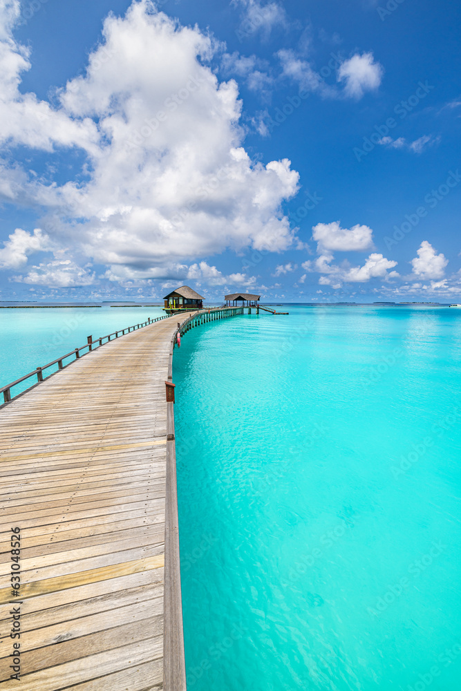 Fototapeta premium Amazing panorama blue sea seascape, sunshine sky clouds. Travel relax calm landscape of Maldives beach coast. Tropical island, luxury water villa resort wooden pier. Vacation destination tranquility