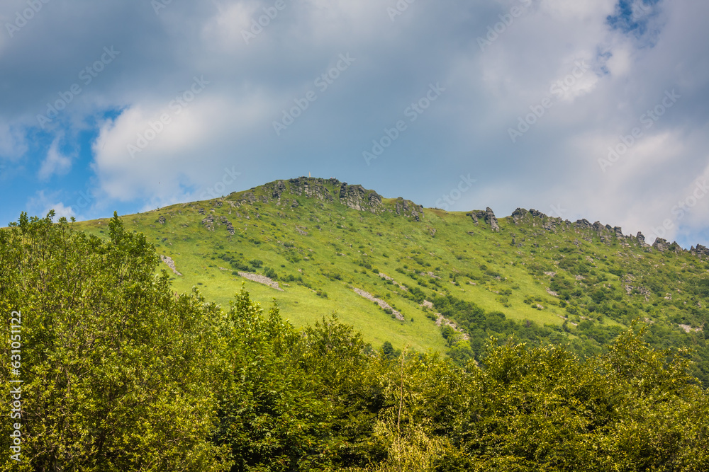 Beautiful view of the Ukrainian mountains Carpathians and valleys.Beautiful green mountains in summer with forests and grass. Water-making ridge in the Carpathians, Carpathian mountains