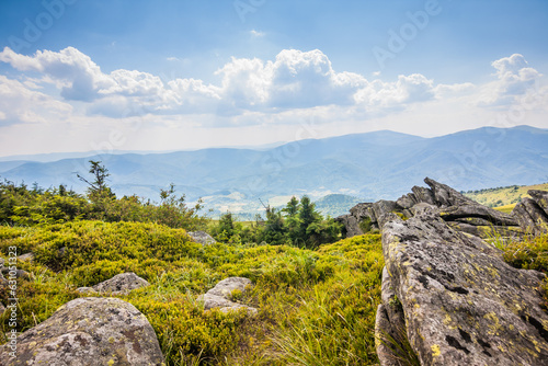 Beautiful view of the Ukrainian mountains Carpathians and valleys.Beautiful green mountains in summer with forests, rocks and grass. Water-making ridge in the Carpathians, Carpathian mountains photo