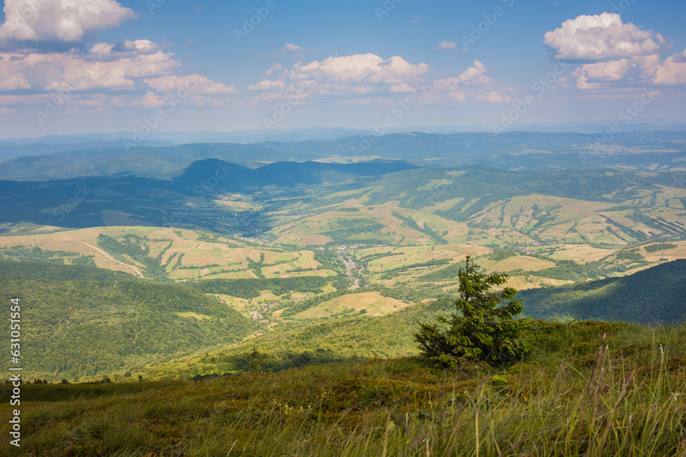 Beautiful view of the Ukrainian mountains Carpathians and valleys.Beautiful green mountains in summer with forests, rocks and grass. Water-making ridge in the Carpathians, Carpathian mountains