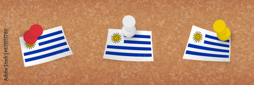 Uruguay flag pinned in cork board, three versions of Uruguay flag.