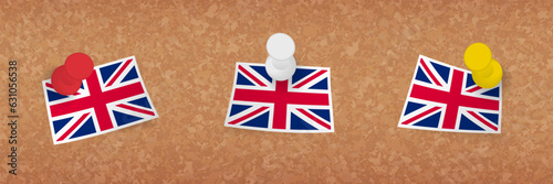 United Kingdom flag pinned in cork board, three versions of United Kingdom flag.