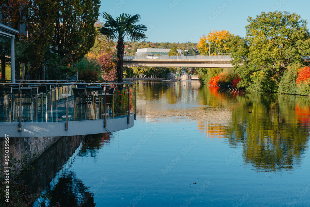 River On Sunset. Townhouses Buildings And Multi-floor Home At Waterfront. Sunset On River In City. Suburb Houses And Residential Building Near River In Europe. House In Nature On Shore On Sunset.