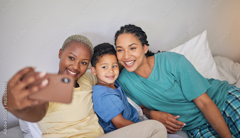 Gay, happy family and selfie in bed with foster boy child and relax at home. Adoption, lesbian couple and lgbt women on social media, smile for profile picture, blog or post in bedroom on the bed
