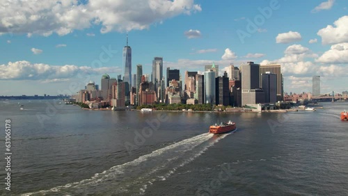 Pristine summer aerial of downtown New York with Staten Island Ferry in foreground