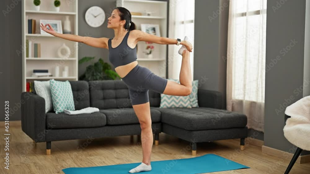 Young beautiful hispanic woman training yoga exercise at home Young beautiful hispanic woman training yoga exercise at home