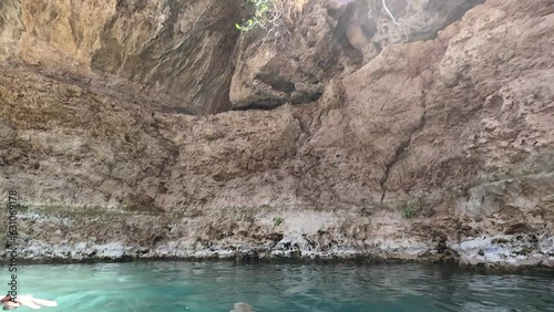 the vibrant turquoise waters of the Gan Hashlosha nature reserve in northern Israel, showcasing the pristine oasis springs flowing through the beautiful limestone landscapes of the popular eco-tourism photo