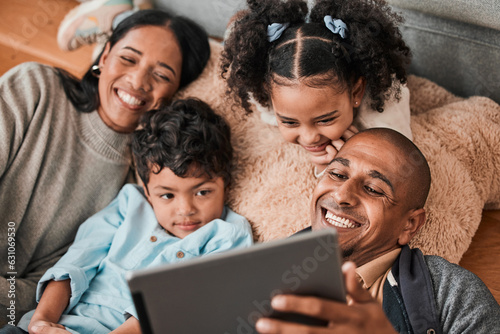 Family  children and parents on tablet for movie  film or cartoon streaming on internet subscription and living room floor. Home  selfie and happy mom  dad and kids watch on digital technology