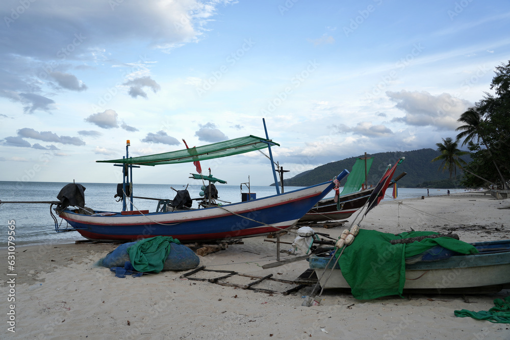 Fishermen's fishing boats used to fish at sea parked on the beach.