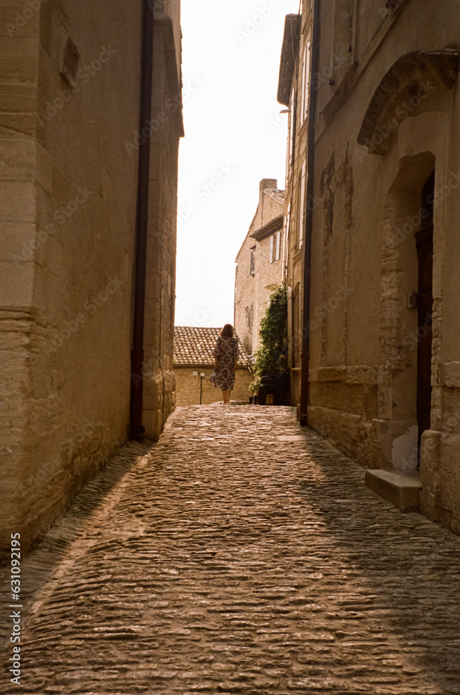 woman in a narrow street in the town
