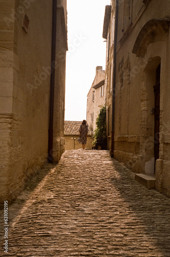 woman in a narrow street in the town