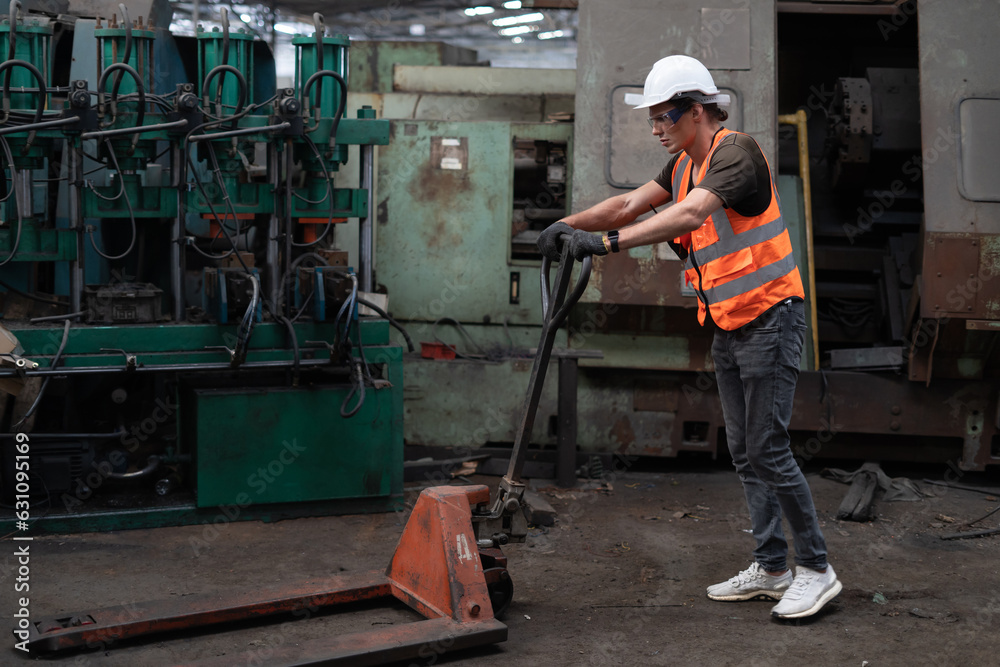 Factory worker with pallet jack Factory worker with pallet jack