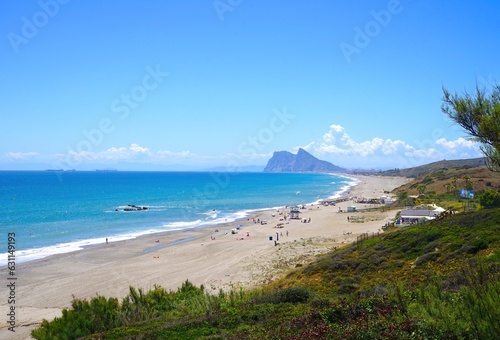 view along the beach near La Alcaidesa with a view towards the Rock of Gibraltar and La Línea de la Concepción, Playa de la Hacienda, Mediterranean Sea, Andalusia, Malaga, Spain