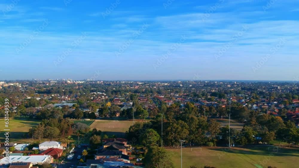 Aerial Drone panoramic view of Sydney NSW Australia city Skyline and looking down on all suburban houses and streets parks and roads Aerial Drone panoramic view of Sydney NSW Australia city Skyline and looking down on all suburban houses and streets parks and roads