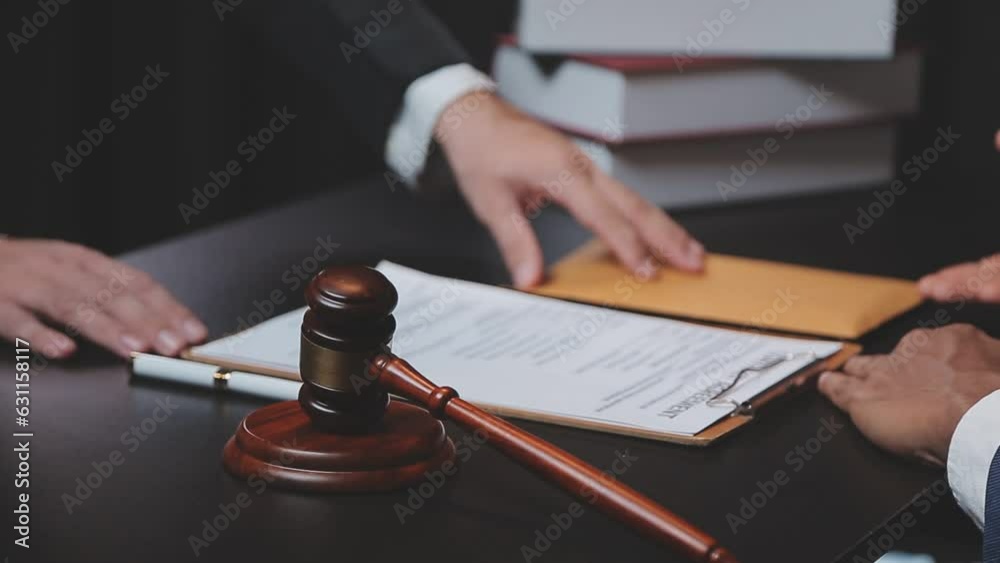 Business and lawyers discussing contract papers with brass scale on desk in office. Law, legal services, advice, justice and law concept picture with film grain effect Business and lawyers discussing contract papers with brass scale on desk in office. Law, legal services, advice, justice and law concept picture with film grain effect