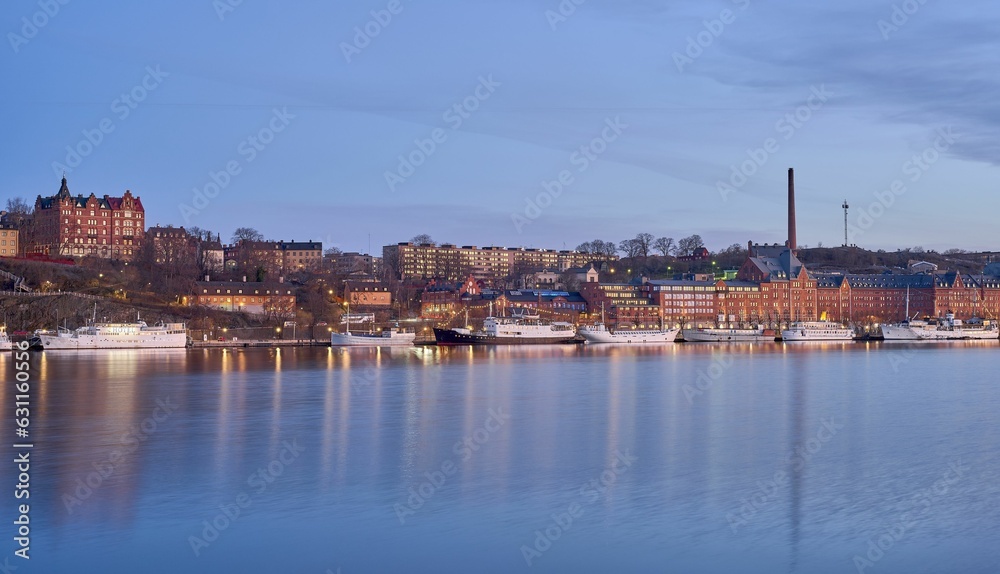 Idyllic scene of Sodermalm in Stockholm situated beside a tranquil lake in Sweden