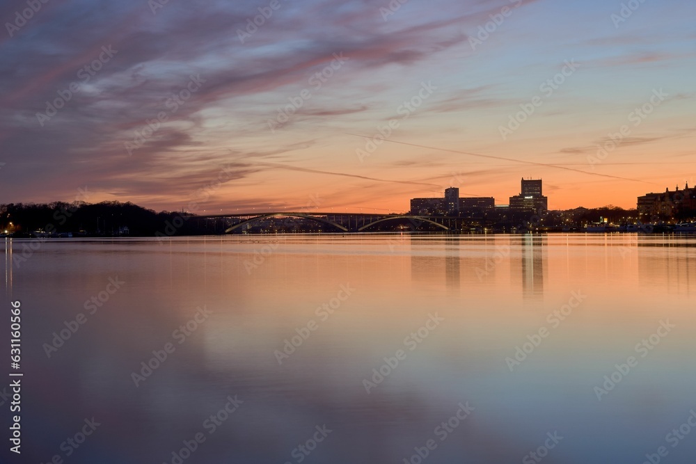 Idyllic scene of Stockholm cityscape on the shore at sunset in Sweden