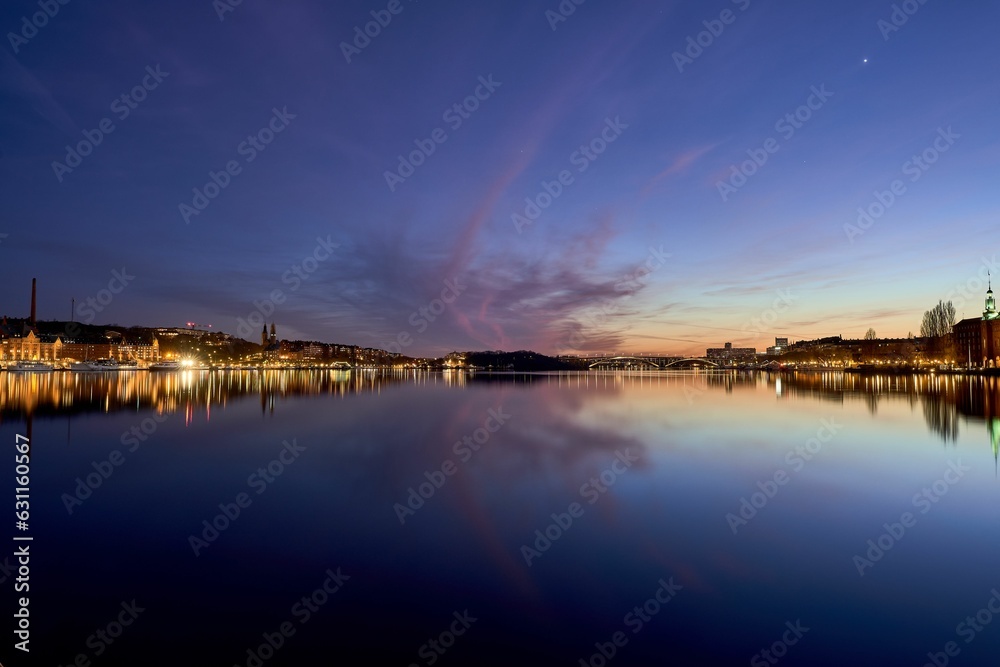 Idyllic scene of Stockholm cityscape on the shore at sunset in Sweden
