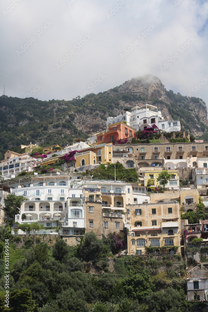 Amalfi coast with beautifull houses and mountain in fog, Positano, Italy