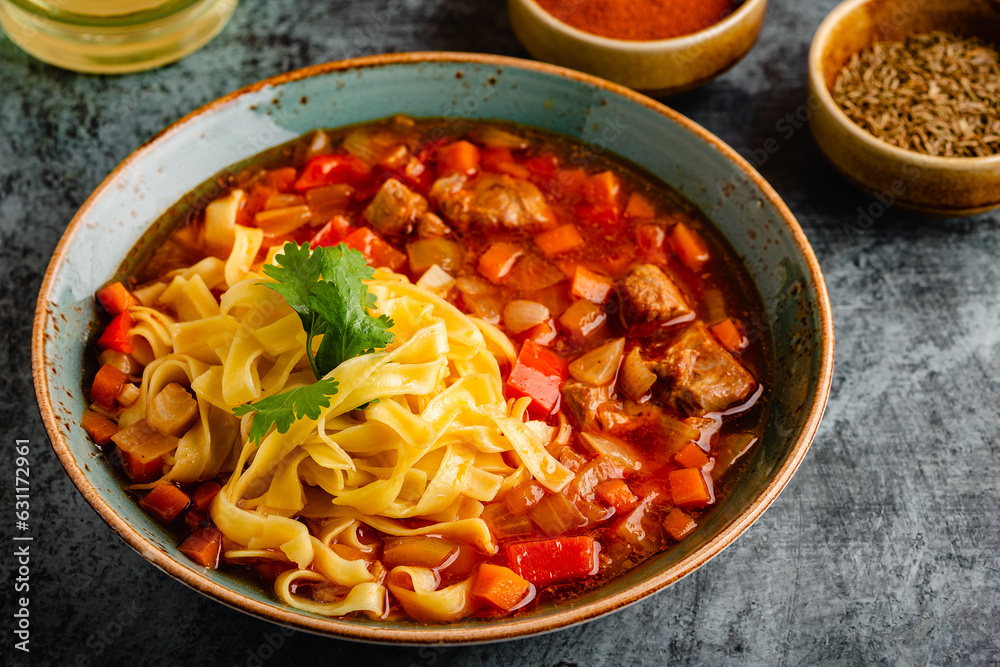 Lagman soup with lamb, homemade noodles and vegetables. Lagman soup with lamb, homemade noodles and vegetables.