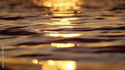 Surface of water waves, beautiful sea surface background at sunset. water in motion under the rays of the sun.