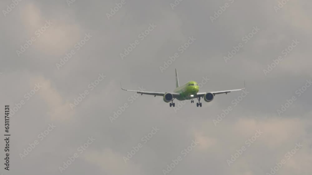 Jet airplane approaching landing at Novosibirsk airport, front view. Passenger plane flies. Travel aviation concept Jet airplane approaching landing at Novosibirsk airport, front view. Passenger plane flies. Travel aviation concept