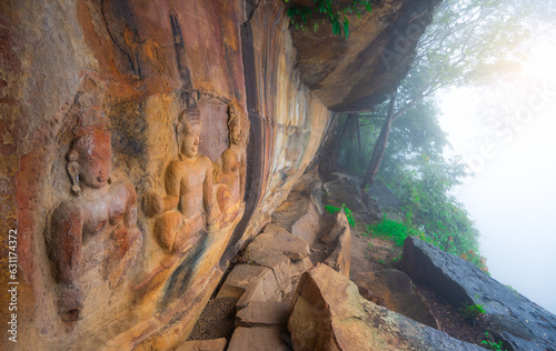 Stone carvings at Pha Mo I Daeng National Park , THAILAND photo