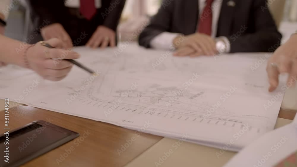 Architects and contractors work at the beginning of the project. Civil engineers and the team working on the architectural project are evaluating their construction project.