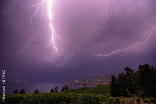 Dramatic image of a stormy lightning sky over Okanagan Lake and the Naramata Bench vineyards
