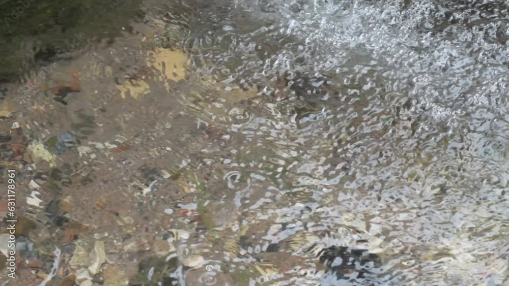 pure real spring water flowing from rocks. close up pure real spring water flowing from rocks. close up