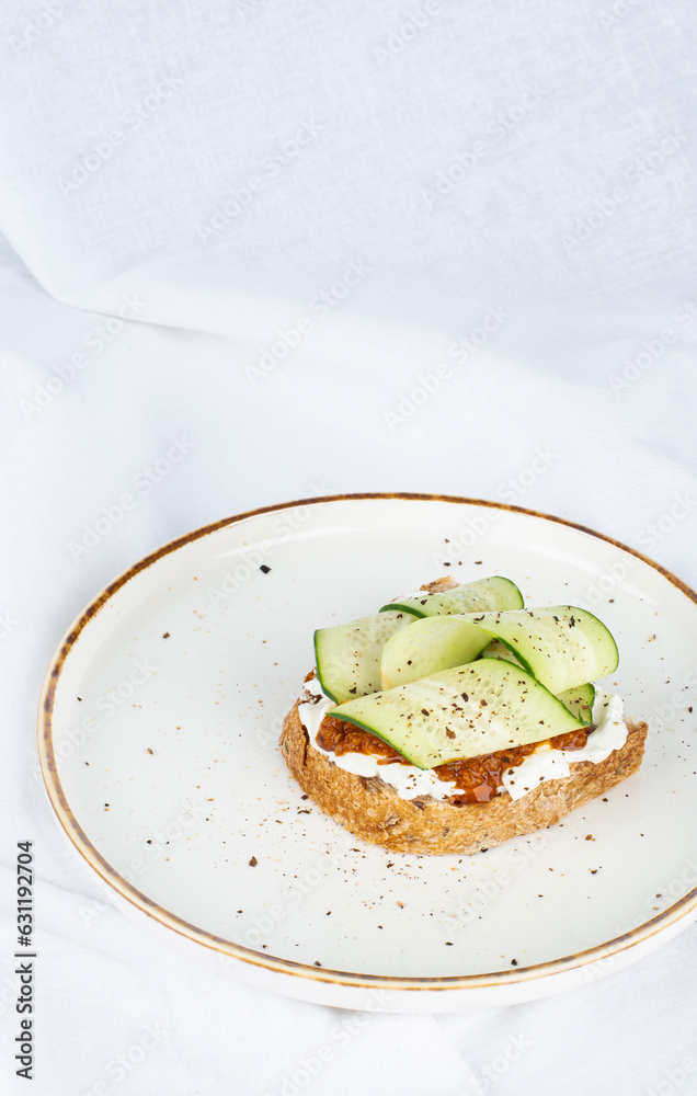 Vegan sandwich with cucumber and sun-dried tomato paste Vegan sandwich with cucumber and sun-dried tomato paste