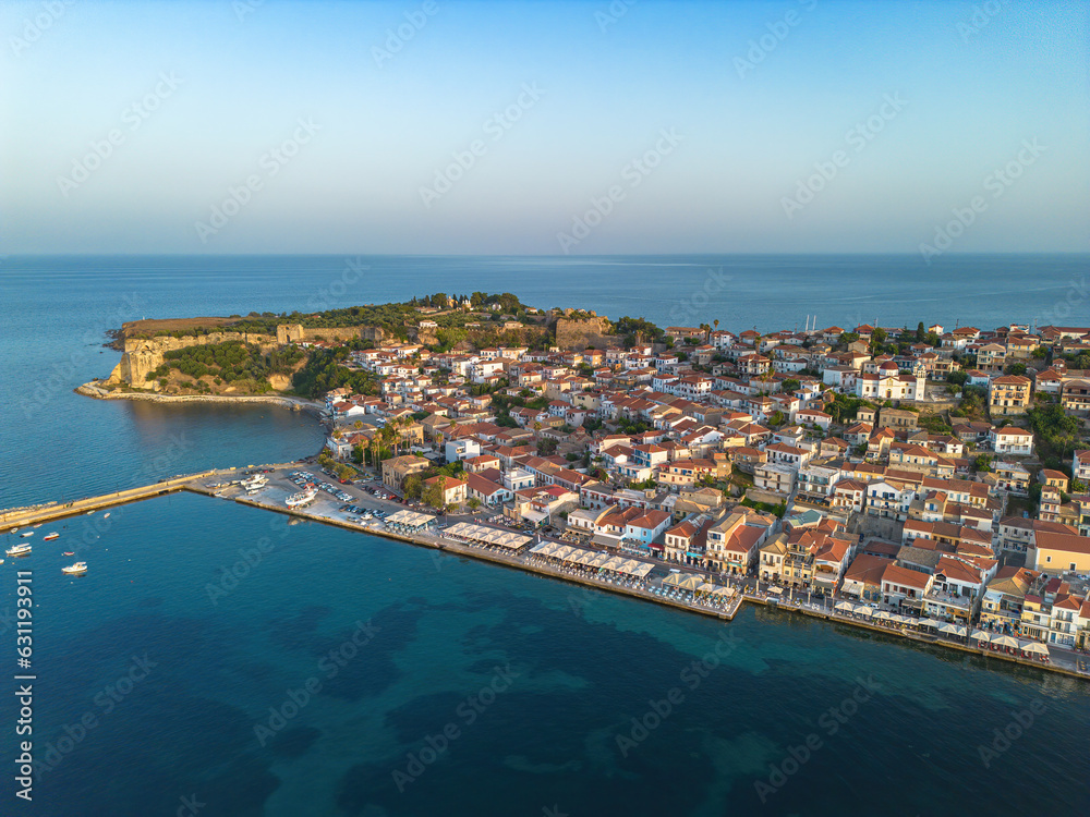 Naklejka premium Aerial view over Koroni seaside city at sunset. Koroni, Messenia, Greece
