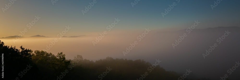 Panorama of fog in the valley at sunrise in Great Smokey Mountains National Park