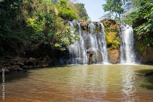 Landscape of the Katieng waterfall surrounded by greenery in Banlung  Cambodia