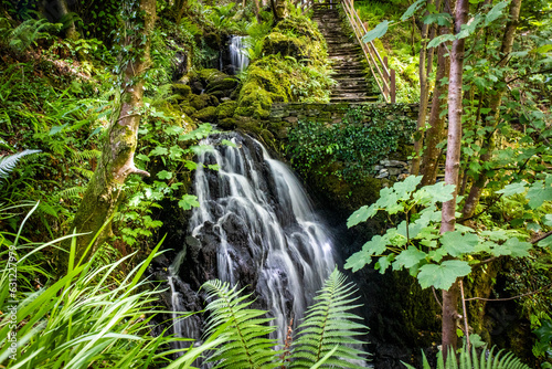 Beautiful hidden waterfall in Connemara National park in summer photo
