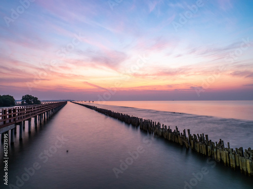 Wallpaper Mural Sea view near mangrove forest with man made wooden barrier for wave protection, under morning twilight colorful sky in Bangkok, Thailand Torontodigital.ca