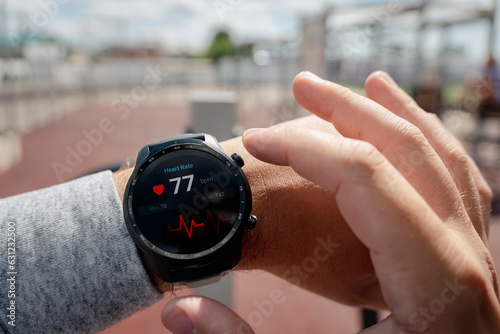Fotografie, Tablou Close-up of smart watch health tracker with heart rate shown on the screen