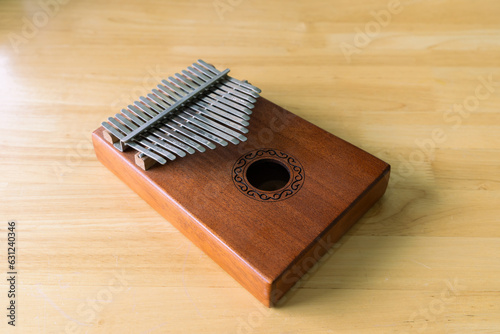 Wooden kalimba on the wooden background. Kalimba, acoustic music instrument from africa. kalimba thumb harp, folk music instrument kalimba (piano)