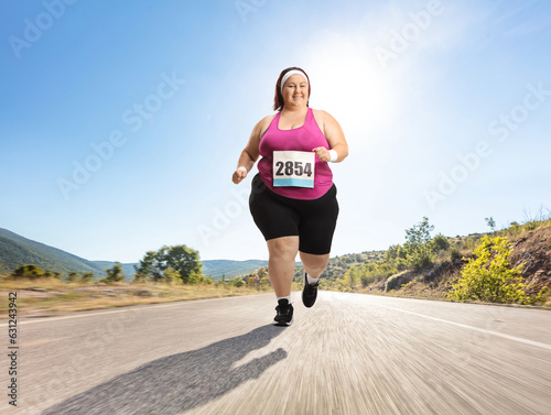 Overweight woman running a marathon on an open road