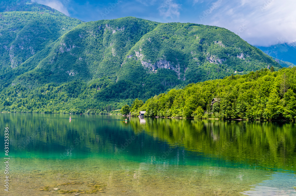 A view of reflections from the northern shore of  Lake Bohinj at Bohinjsko Jezero, Slovenia in summertime