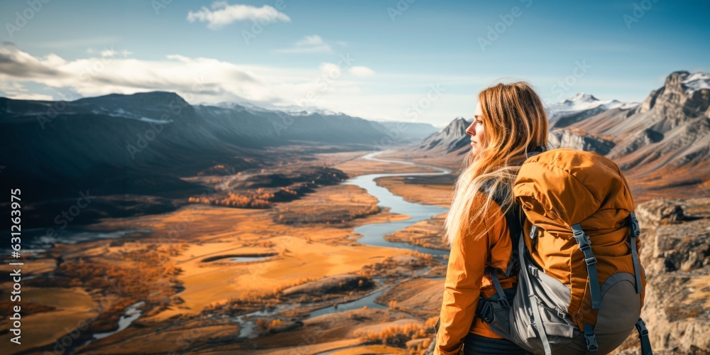 a young woman with backpack is standing on top of a mountain 